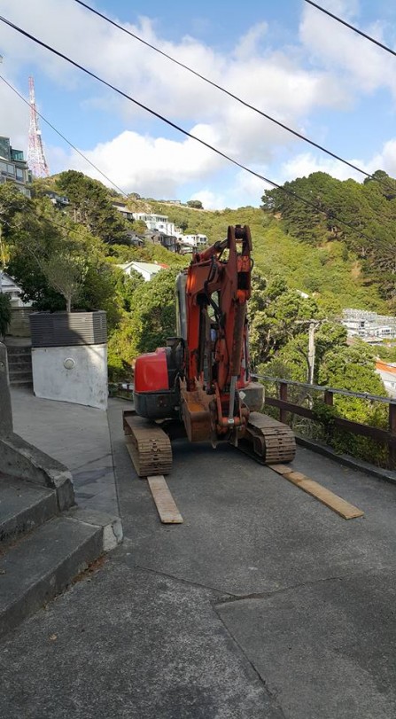 Getting the digger on site at Roseneath to lay 6x1 down to not damage the driveway.